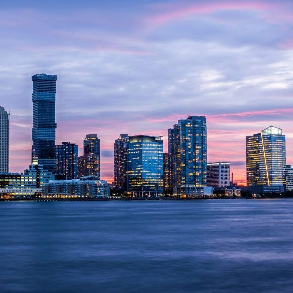 Cityscape across the harbour at dusk